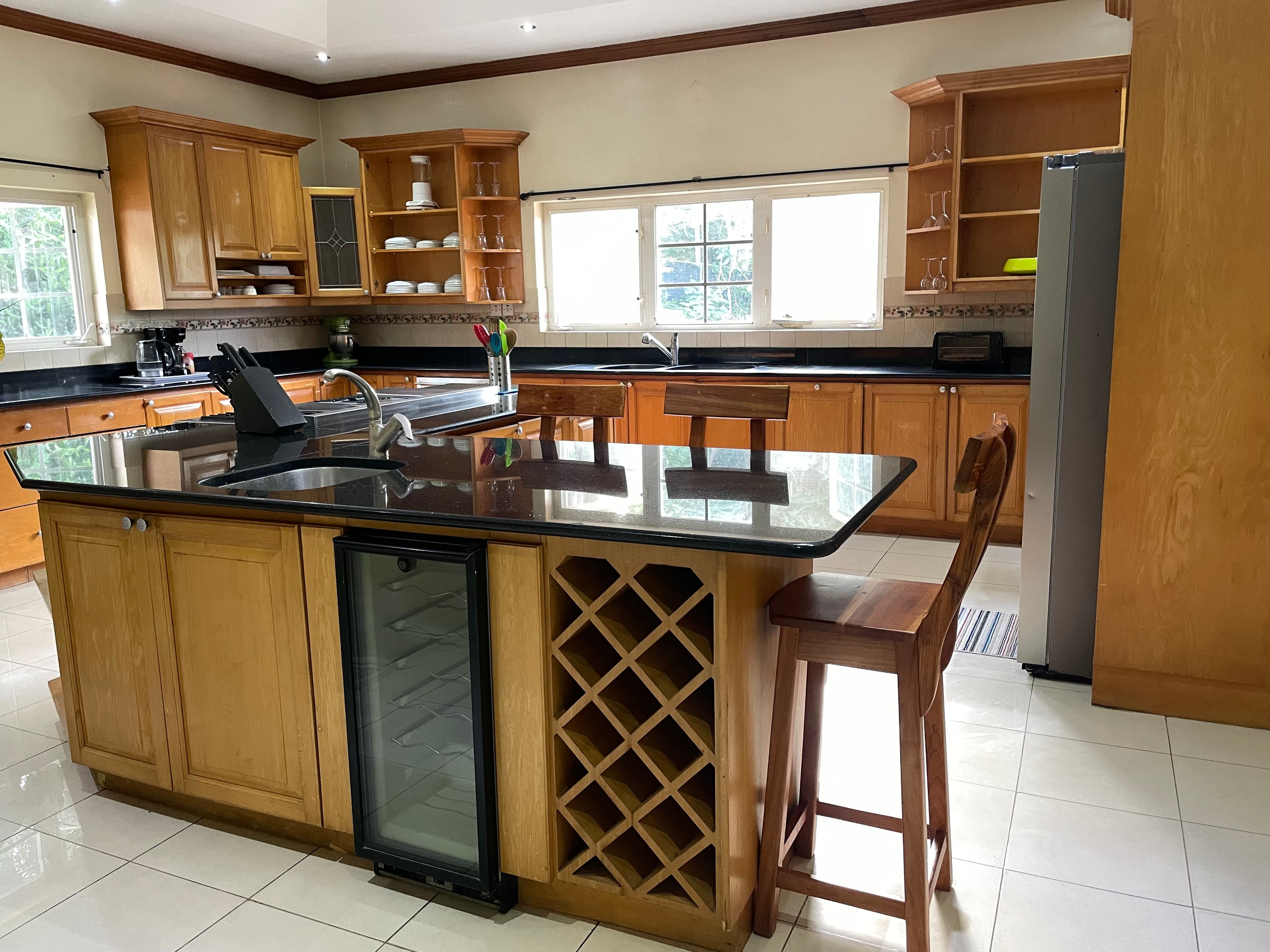 Sweet Dreams Villa kitchen with wood cabinetry and island seating